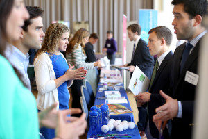 From left, General Electric employees and College of the Holy Cross alumni, Whitney Fremeau '11, Richard DiMatteo '12 and Angela Chaisson '15 all talk to current College of the Holy Cross students during a job fair held on 9/24/14.